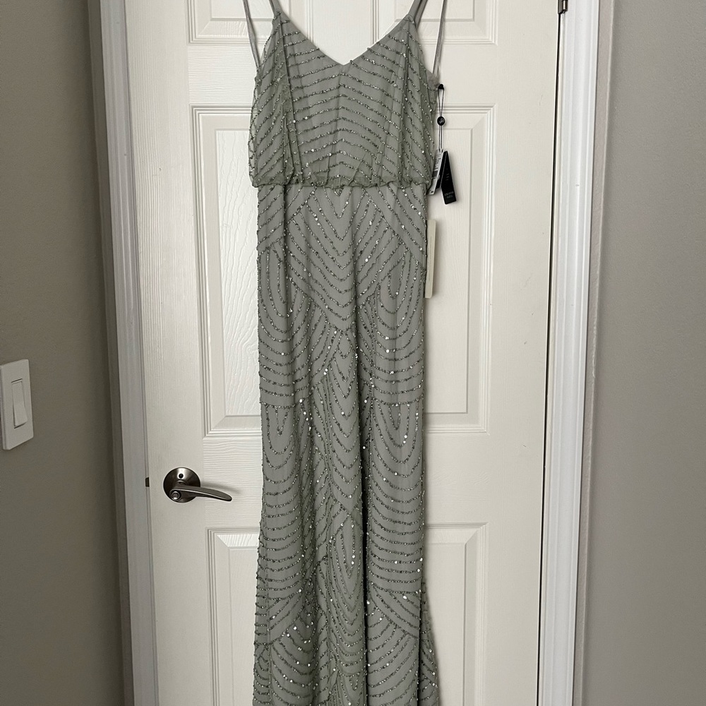 Never worn Adrianna Papell Beaded Gown
Tags attached
Size 6
Color mint - Picture 3 of 7